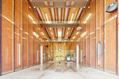 Washing hall for vehicles: the wooden structure was covered with washable plastic