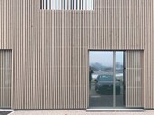 Polo Park factory building: wooden formwork facade